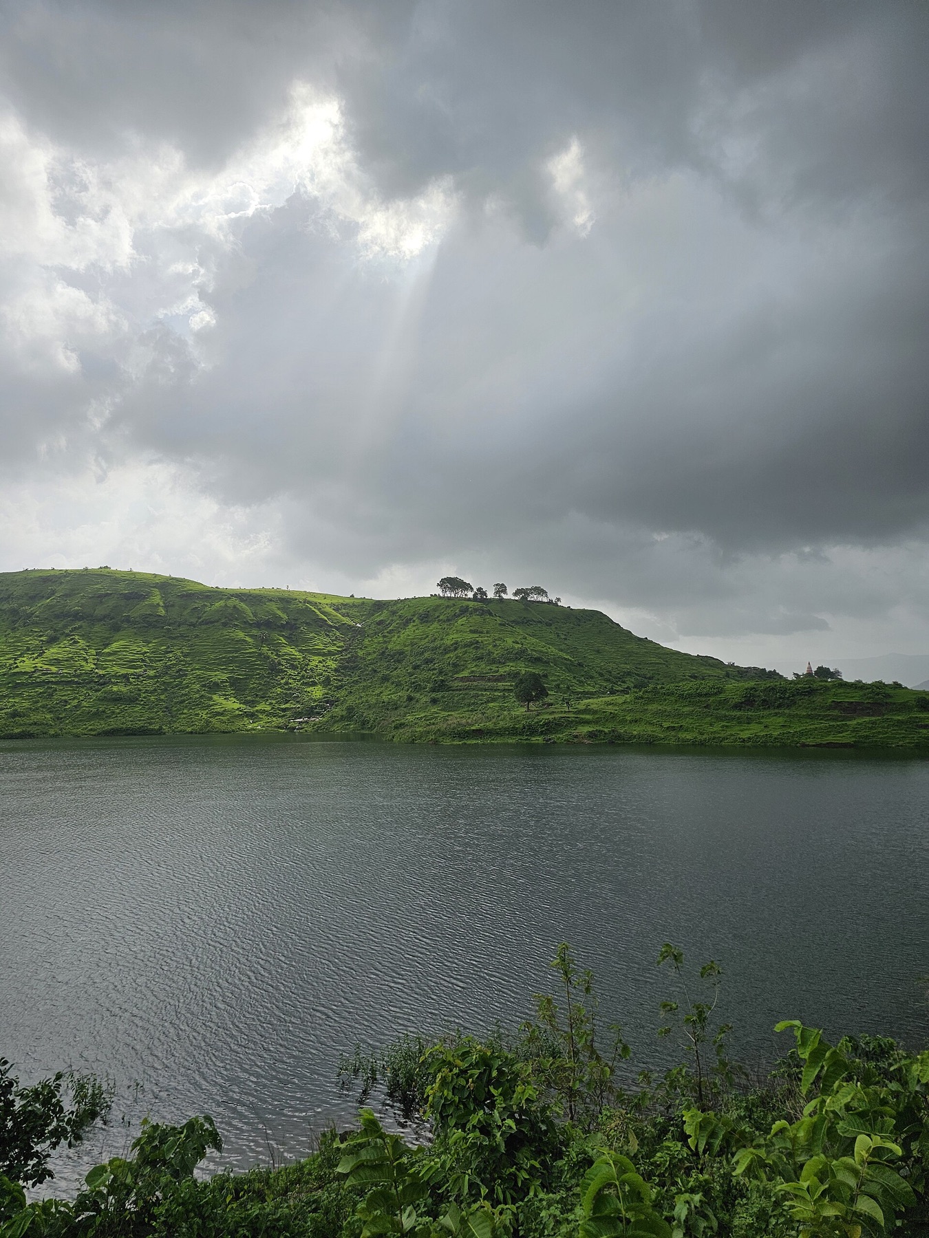 Cloud and monsoon light over a green Western Ghats landscape